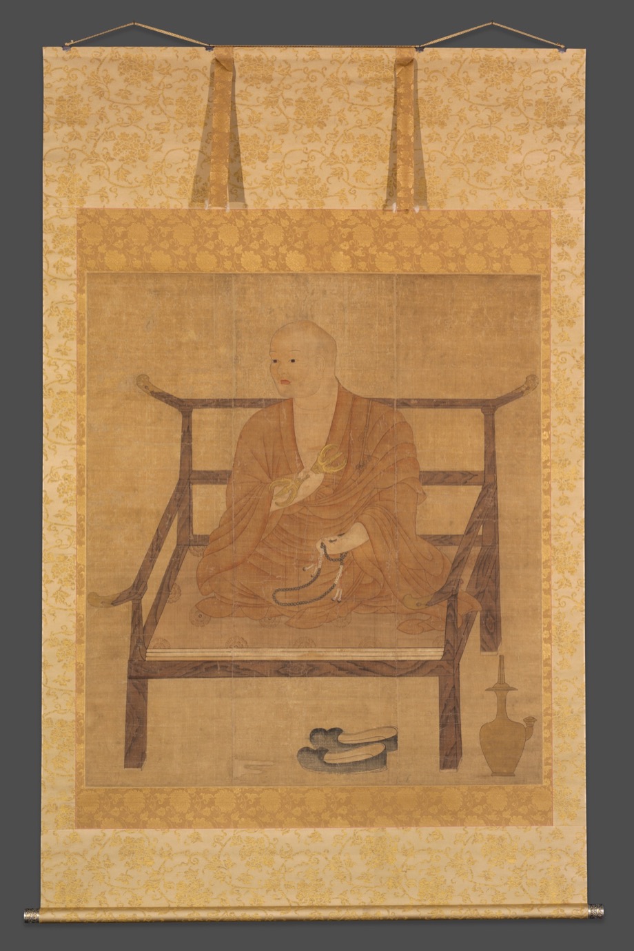Anonymous 14th-century hanging-scroll portrait of Kūkai seated holding a ritual implement and prayer beads